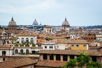 Fototapeta na wymiar View of Rome, Italy, showing old building, rooftops and church domes