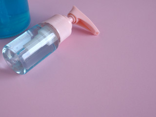 The alcohol gel in the bottle, hand cleanser pump kills some germs, bacteria, and viruses. Health concept. Copy space..