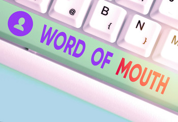 Writing note showing Word Of Mouth. Business concept for information that is transmitted without...