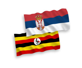 Flags of Uganda and Serbia on a white background