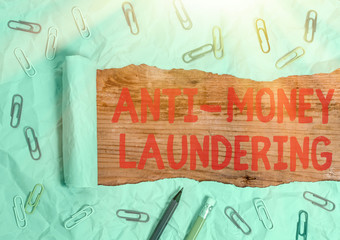 Handwriting text Anti Money Laundering. Conceptual photo regulations stop generating income through...