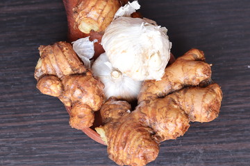 fresh ginger and garlic isolated on black background