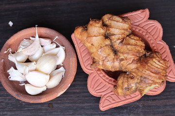 fresh ginger and garlic isolated on black background