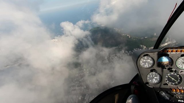 Rio De Janeiro aerial view! Helicopter view of the Brazilian capital city. Town, streets, and buildings. Panoramic view of Brazil with famous beach background. Aerial cityscape.