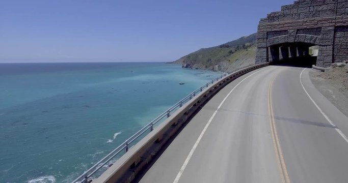 Flying along Pacific Coast Highway into tunnel at Big Sur