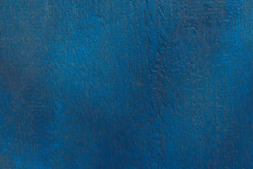 Rustic wood texture or background with blue paint.