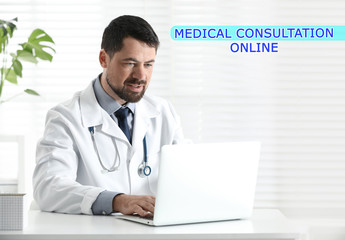 Doctor using laptop at workplace. Medical Consultation Online