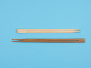 Sushi sticks on a blue background.