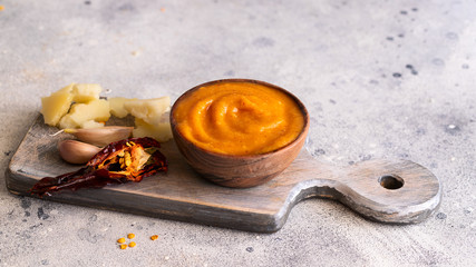 Almogrote , cheese paste form La Gomera, Canary Islands in wooden bowl on cut board with hard goat...