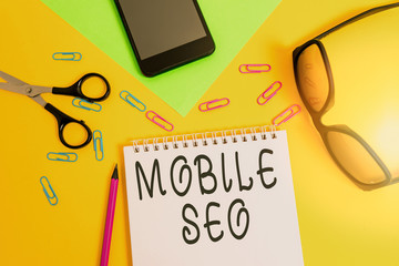 Writing note showing Mobile Seo. Business concept for process of optimizing a website to rank for...