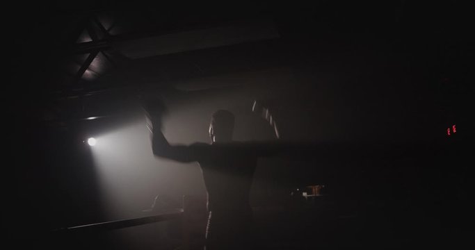Silhouette of boxer celebrating after winning fight