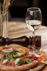 pizza with jamon and herbs