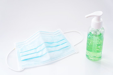 A Bottle Of Green Alcohol Sanitizer Gel And Mask On White Background Concept Protect Infection And Kill