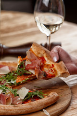 pizza with jamon and herbs