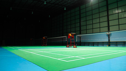 The green badminton court used in competition and exercise for being polite and good.