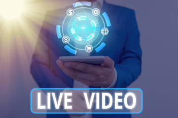 Writing note showing Live Video. Business concept for broadcast a live video or streamingfeed to an...