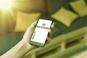 Writing note showing Hr Solutions. Business concept for all the technology businesses use to manage...