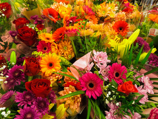 Fototapeta na wymiar A bright bouquet of different flowers shot from above in a flower shop.