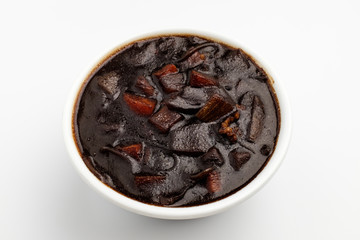 Jjajang sauce with vegetables and jjajang on white background