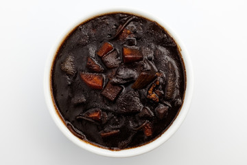 Jjajang sauce with vegetables and jjajang on white background