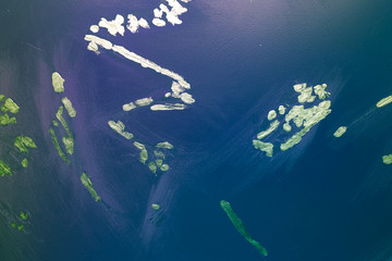 Blue abstract background for design with yellow dots. Painted scratch texture with place for text.