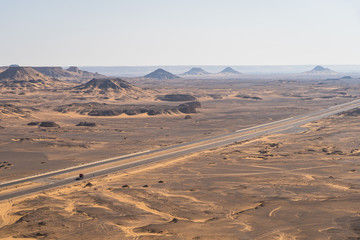 Highway to black desert near Baharia in Sahara, central Egypt