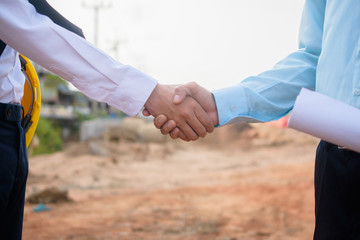 Business partner shake hand agreement  project building estate construction