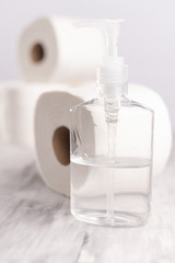 Sanitizer disinfector on the table, light background. Fighting the virus and coronavirus