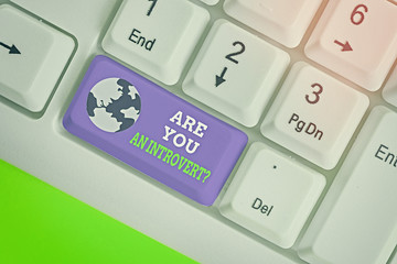 Writing note showing Are You An Introvertquestion. Business concept for demonstrating who tends to...