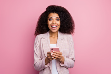 Photo of beautiful excited dark skin lady hold telephone read positive blog post comments open...