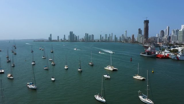 Aerial panoramic view of the Cartagena Bay. Cargo ship left port in Cartagena, Colombia. Beautiful yachts drift in the bay.