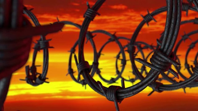 3d Animation of a prison barbed wire fence at sunset, close-up view