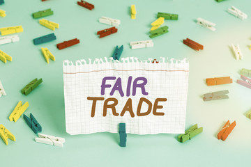 Conceptual hand writing showing Fair Trade. Concept meaning buying goods directly from producers in...