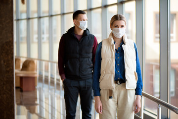 Concept of coronavirus quarantine. MERS-Cov, Novel coronavirus, man and woman with medical face mask