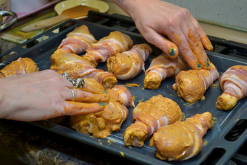 chicken legs wrapped in bacon