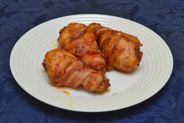 chicken legs wrapped in bacon