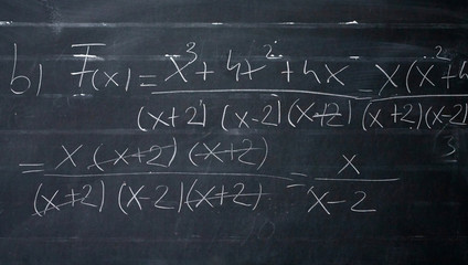 Maths formulas written by white chalk on the blackboard background. © erika8213