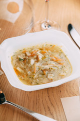 Serving dishes with mashed soup in the restaurant. Vegetable soup in a white plate.