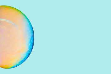 Wallpaper sphere with turquoise green and orange on colorful background