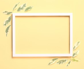 Flay lay - Nature background made from white photo frame and fresh leaves