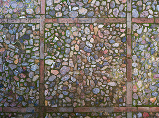 Historical town centre pavement. Detail of rounded stones set into original pavement.