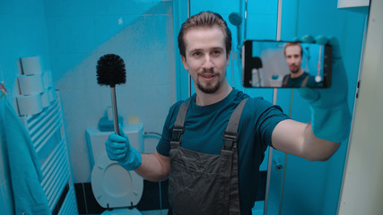 Male person talking about toilette brush to smartphone camera