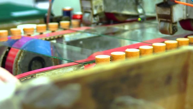 Clip of operator working in a glass manufacturing industry manufacturing and processing of ESG glasses. Close up.