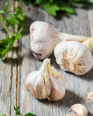 Garlic on a grey wooden table. Rustic style	