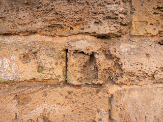 Wall with stones in colors such as dark red, light red
