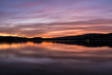 Fototapeta na wymiar sunset on coast of lake