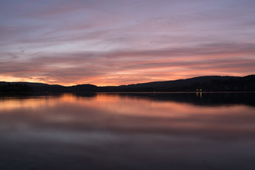 sunset on coast of lake