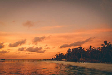 Fototapeta na wymiar Cloudy sunset on the beach