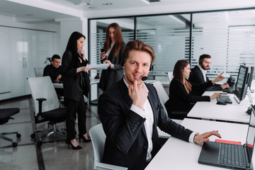 Fototapeta premium thoughtful call center worker look at the camera
