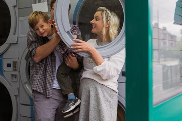Fototapeta na wymiar playing family in laundry shop